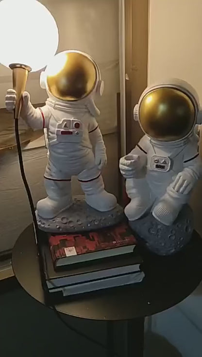 Astronaut Figure Holding the Moon Desk Lamp